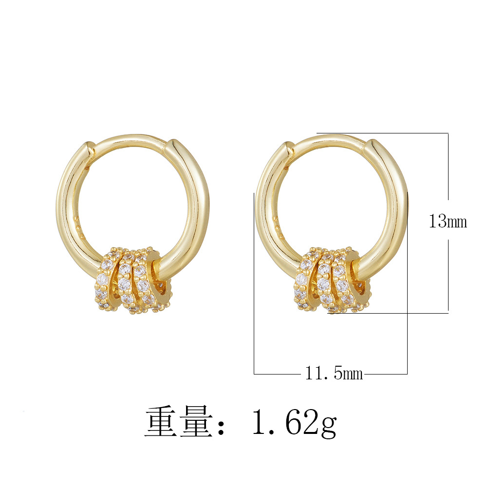 A pair of exquisite diamond-encrusted small hoop sterling silver drop earrings with a minimalist, trendy, and fashionable style.
