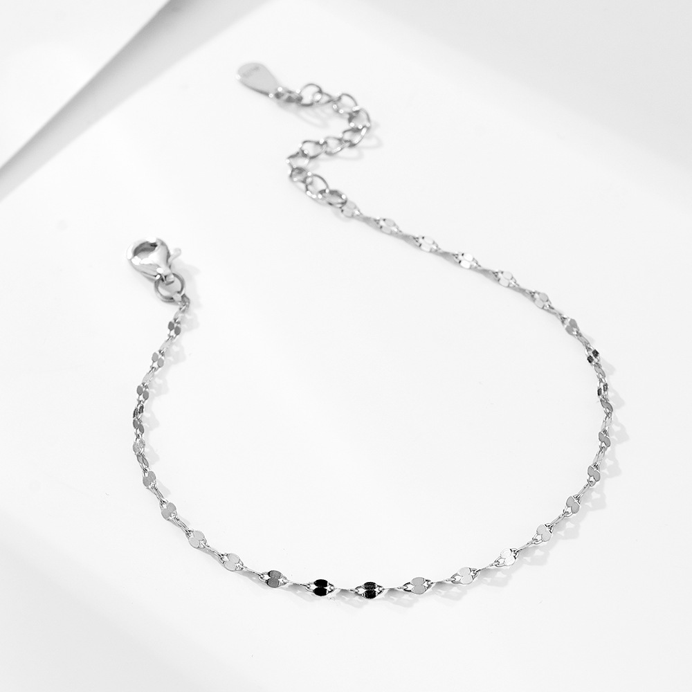 S925 sterling silver bracelet plated with 14K gold. Japanese-style design, exquisite and simple, sparkling with the word "kiss" on a plain chain.